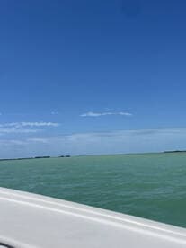 A view of the water and sky, but the image lacks clarity and identifiable features.