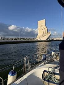 A scenic view from a boat showcasing a prominent landmark against a beautiful sky, perfect for capturing the essence of a memorable boating experience.