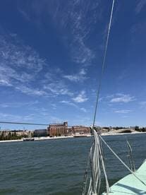 A scenic view from a yacht showcasing the beautiful skyline and architecture along the waterfront, perfect for leisurely sailing experiences.