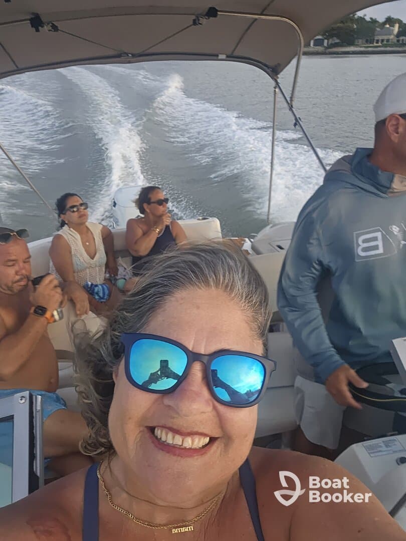 A joyful group enjoys a boat ride, capturing memories and laughter on the water. Perfect for celebrating special moments with friends.