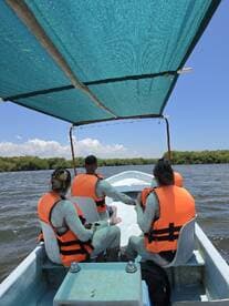 A group of friends enjoys a boat ride, showcasing their adventurous spirit while exploring the waters. Perfect for those seeking unique experiences on the water.