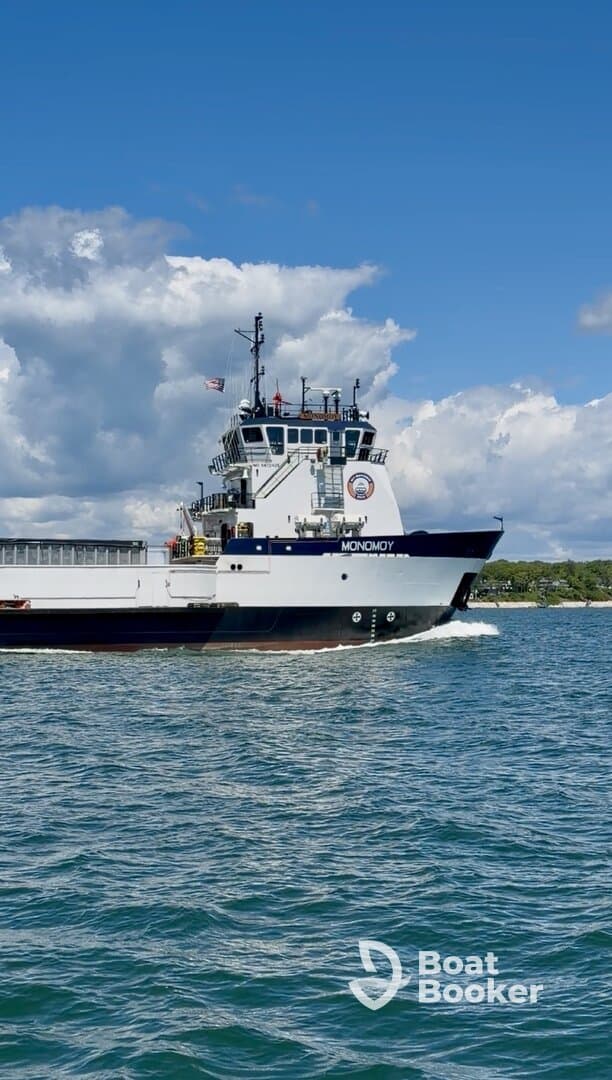 A striking view of the MONOMOY vessel cruising through clear waters, showcasing its robust design and maritime capabilities.