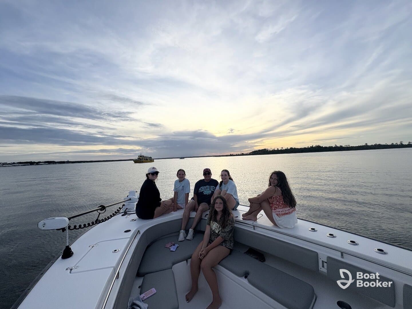 A group of friends enjoys a beautiful sunset on a boat, creating lasting memories on the water — perfect for gatherings and celebrations.