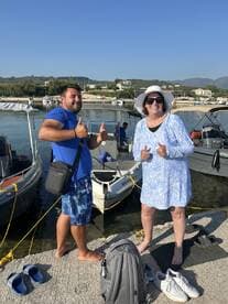A cheerful group poses for a photo at the marina, showcasing their excitement for a day on the water. Perfect for capturing memorable moments before embarking on a boating adventure.