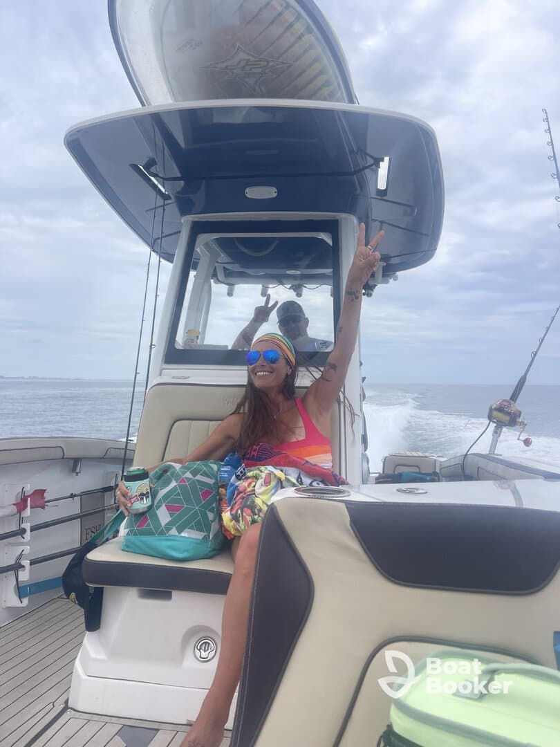 A joyful moment on a boat with friends, showcasing a fun day on the water — perfect for fishing adventures or leisure cruising.