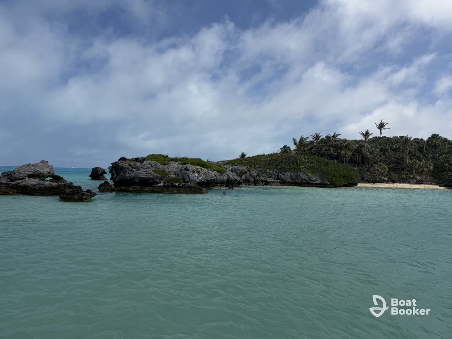 A stunning view of a secluded island with rocky formations and lush greenery, perfect for exploring the natural beauty of the coastline.