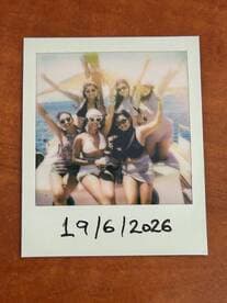 A joyful group of friends celebrates on a boat, capturing the fun of their day at sea — perfect for memorable outings and party adventures.