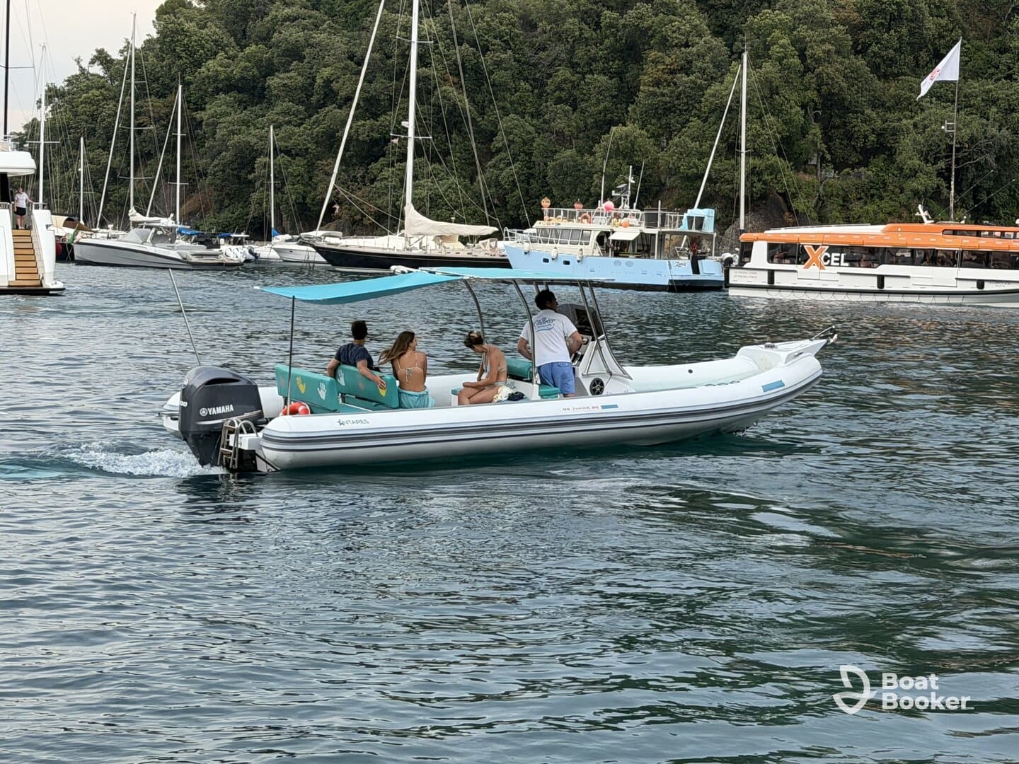 A group enjoys a leisurely ride on a small boat, surrounded by a scenic marina filled with other vessels — perfect for exploring coastal waters.