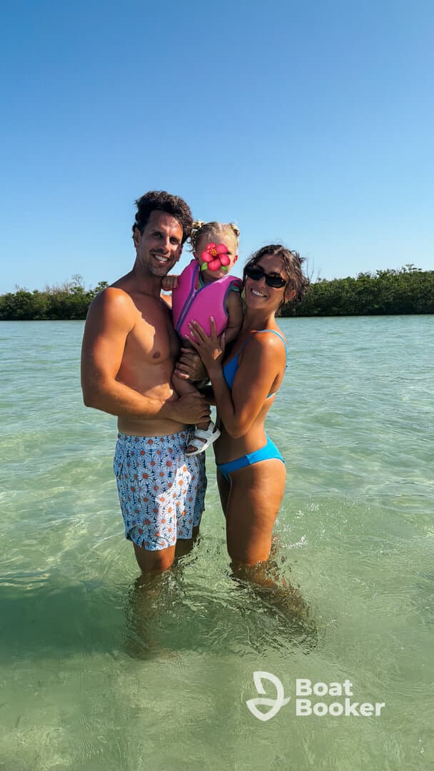 A joyful family enjoys a sunny day in the water, creating lasting memories together — perfect for family vacations and beach outings.