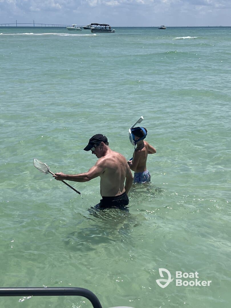 A father and son enjoy a fun day of snorkeling in clear waters, showcasing a perfect family adventure at the beach.
