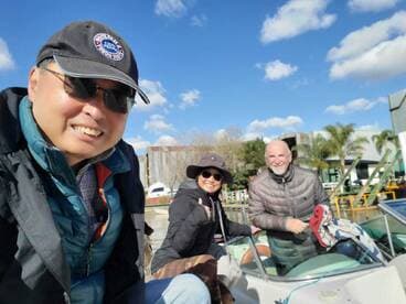 A cheerful group of friends poses on a boat, capturing a moment of camaraderie and adventure on the water.