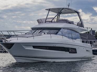 A sleek yacht docked in calm waters, showcasing its elegant design and modern features — perfect for luxury cruising or private charters.