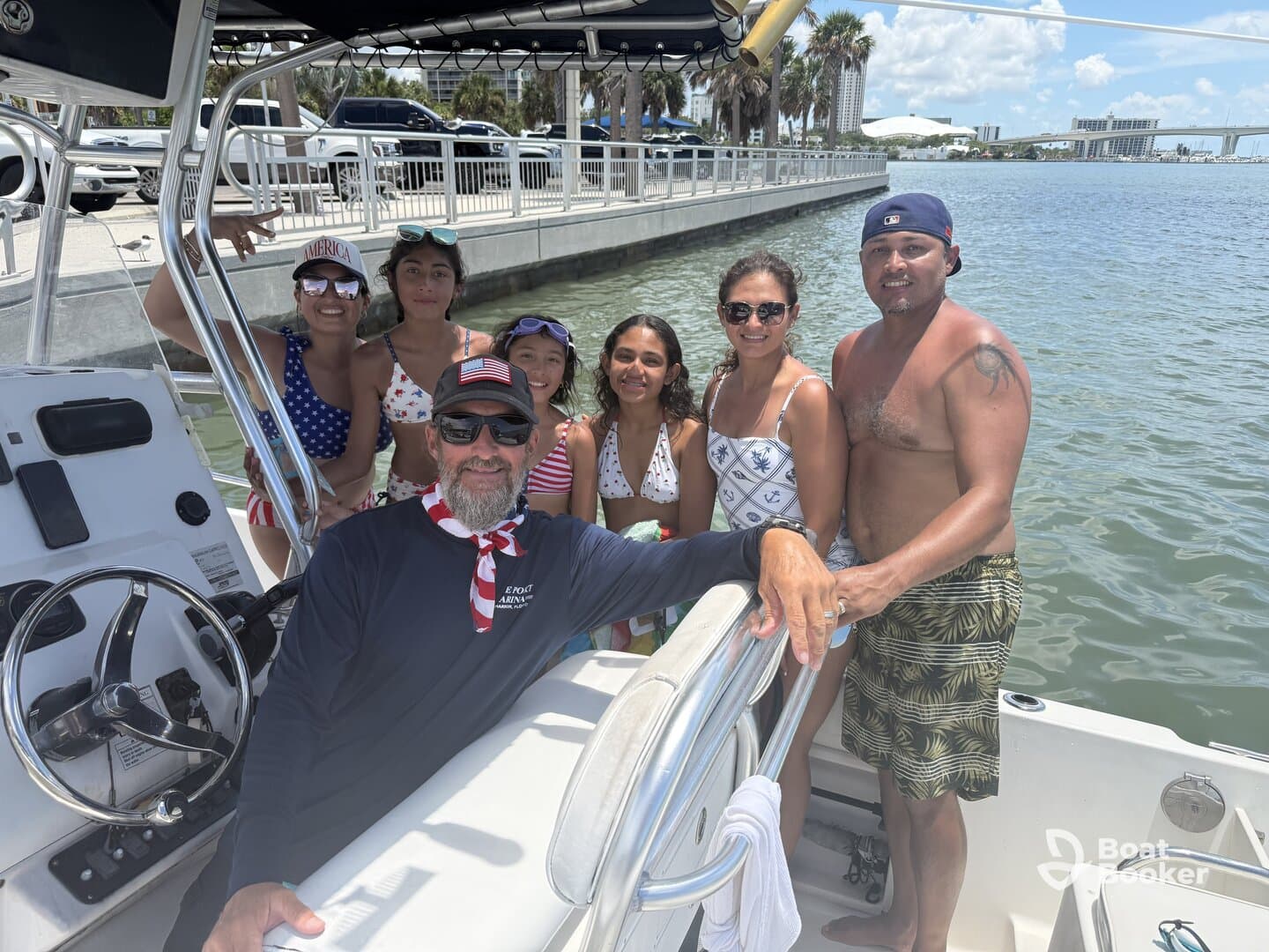 A joyful family poses together on a boat, capturing a fun day out on the water. Perfect for family outings and summer adventures.