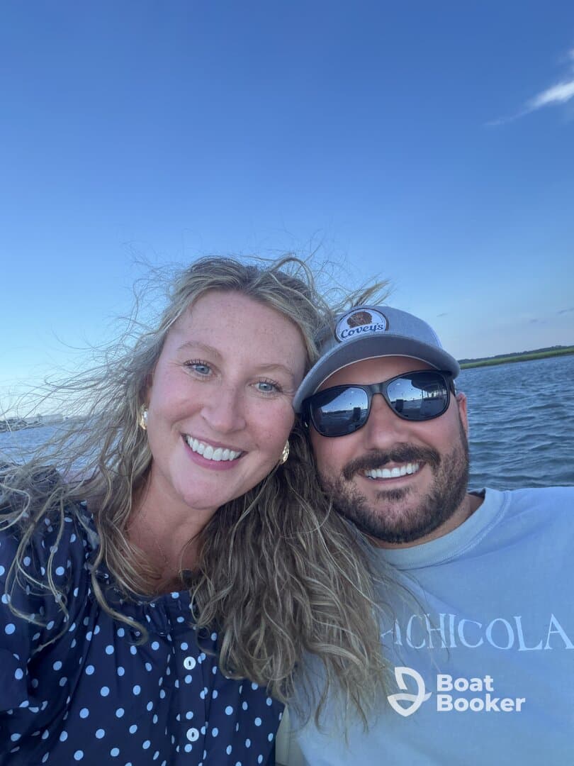 A happy couple enjoys a moment on the water, capturing their joy while boating — perfect for romantic getaways or memorable adventures.