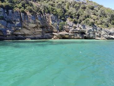 A stunning view of a rocky coastline with clear turquoise waters, perfect for exploring the natural beauty of the area.