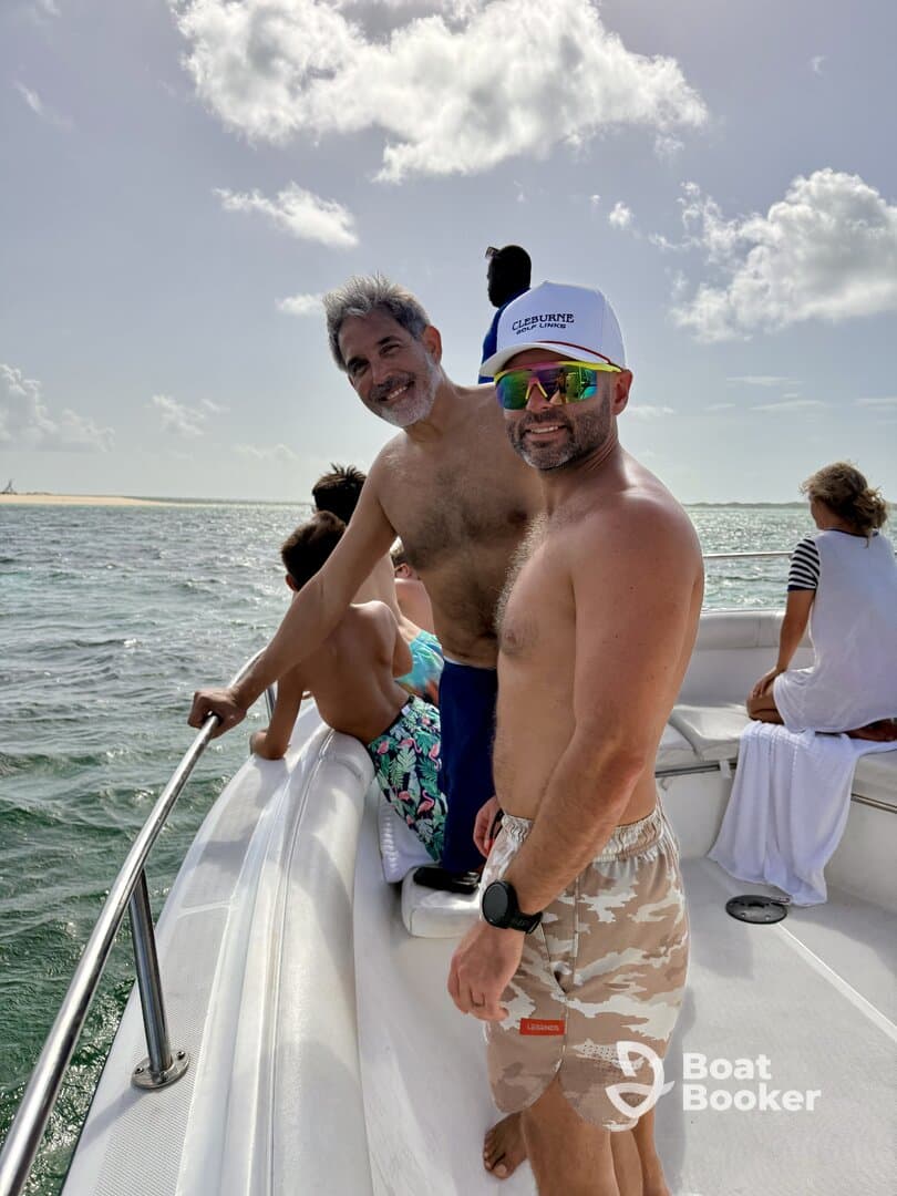 A lively group of friends enjoys a day on the water, capturing the essence of fun and camaraderie aboard a boat.