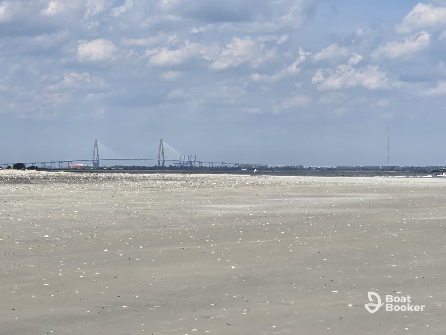 A distant view of a bridge and shoreline, with unclear details and no identifiable subjects.