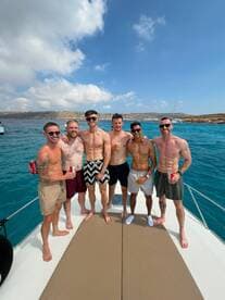 A group of friends enjoys a fun day on the water, celebrating together on a boat — perfect for summer outings and memorable adventures.