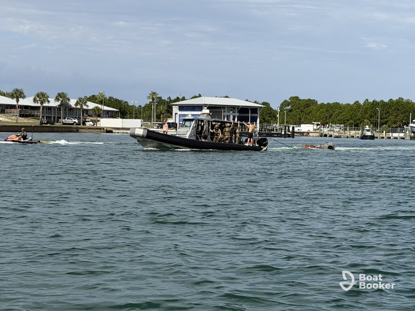 A thrilling scene on the water featuring a jet ski and a boat, showcasing the excitement of on-water activities. Perfect for adventure seekers looking to enjoy a day out on the waves.