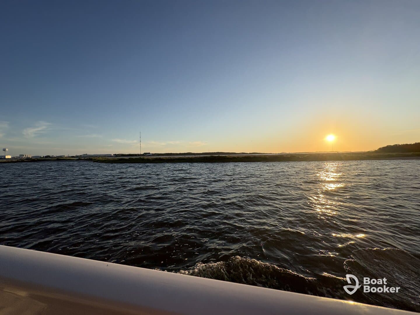 A serene sunset view over the water, capturing the tranquil beauty of the evening sky — perfect for romantic boat rides or peaceful escapes.