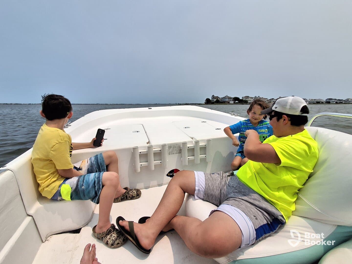 A joyful moment on the water as a family enjoys their time aboard a boat, with kids engaged in fun activities. Perfect for capturing family adventures on the water.