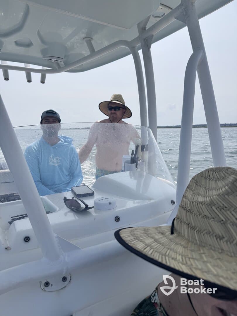 Two men enjoy a day on the water, showcasing the camaraderie and fun of boating adventures.