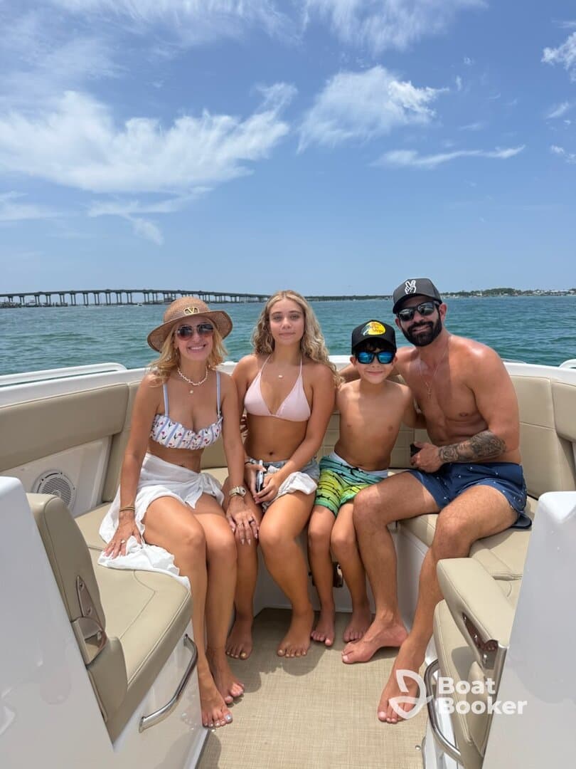 A joyful family enjoys a sunny day on the boat, capturing the essence of summer fun and togetherness on the water.