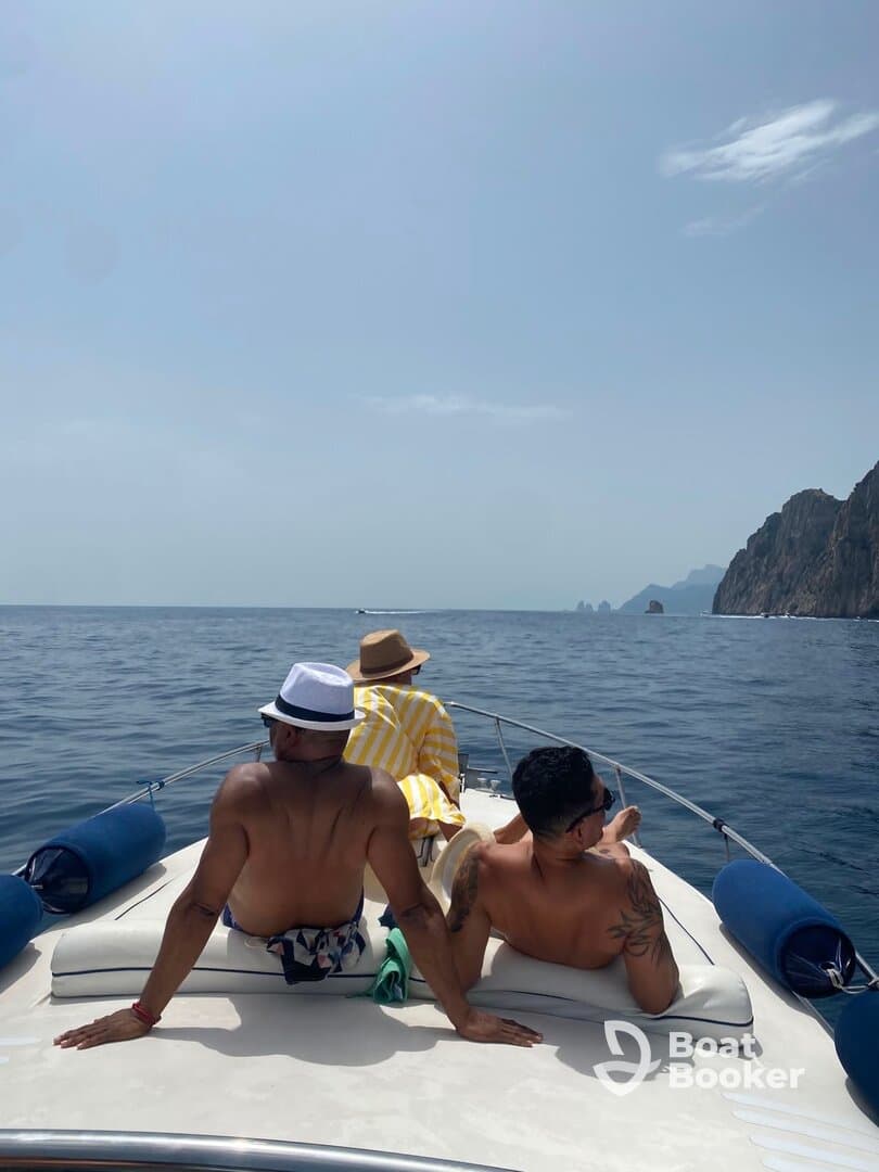A group enjoys a relaxing day on the boat, soaking up the sun and taking in the ocean views — perfect for a leisurely getaway.