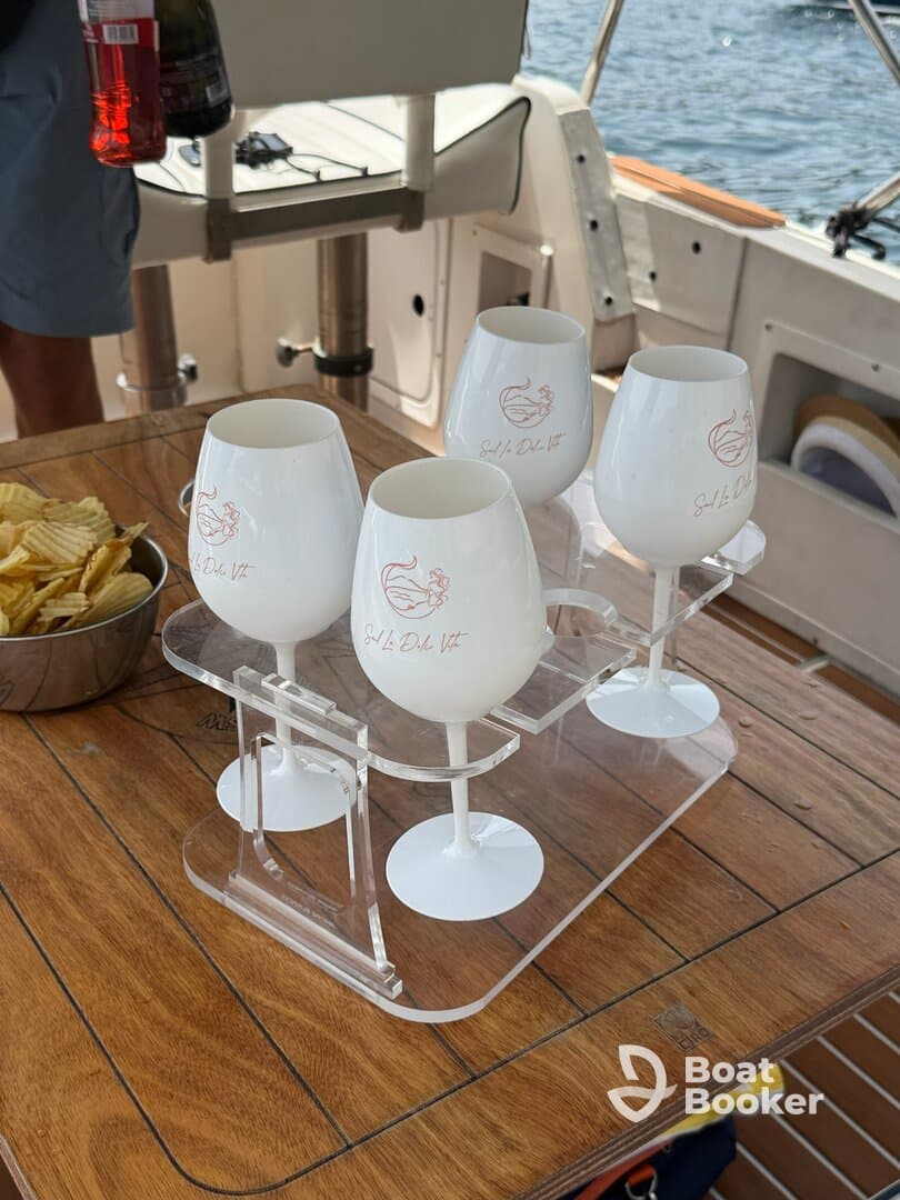 A stylish display of cocktails and snacks on a boat, perfect for enjoying refreshments while cruising on the water.