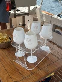 A stylish display of cocktails and snacks on a boat, perfect for enjoying refreshments while cruising on the water.
