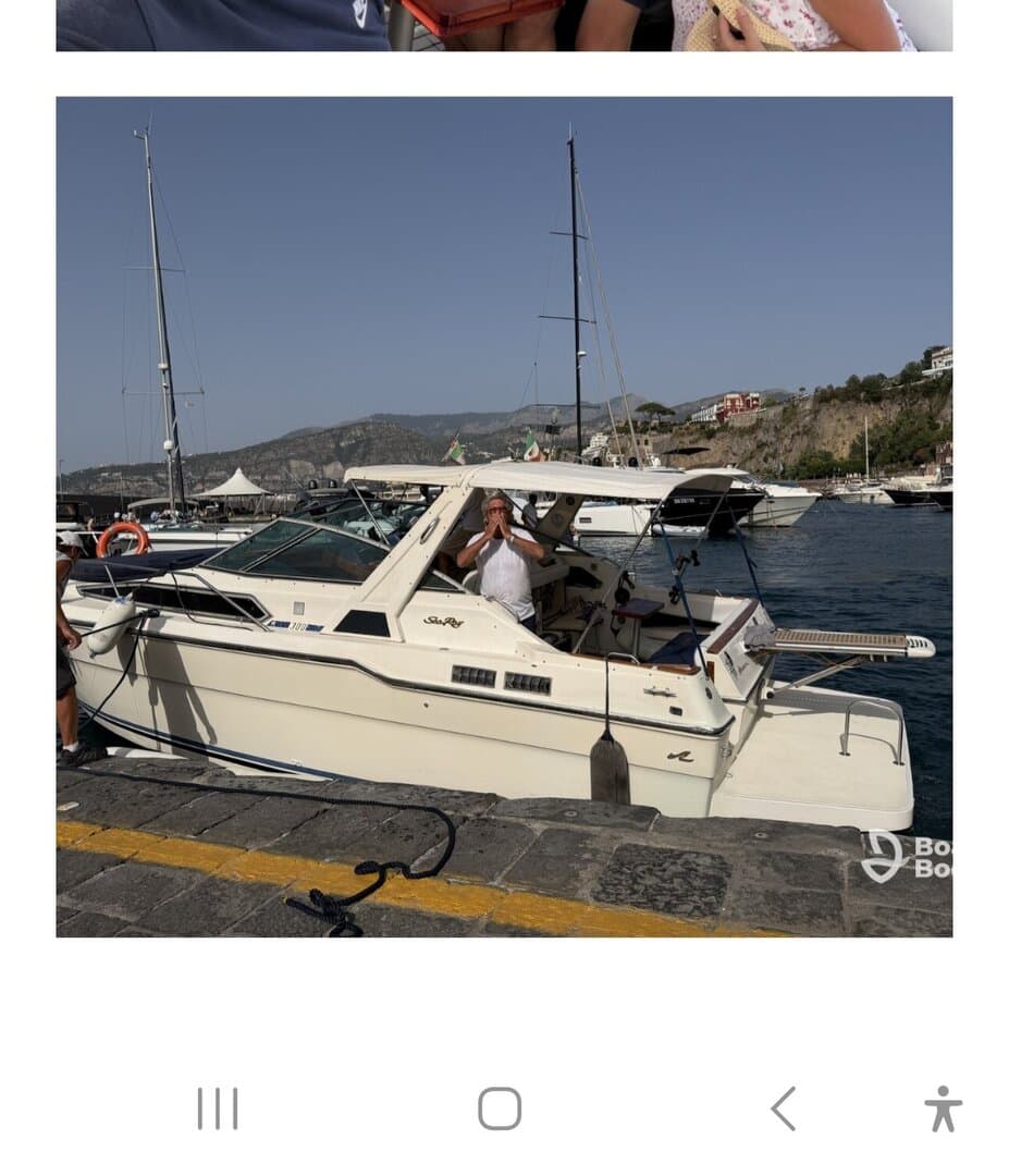 A classic speedboat docked at the marina, showcasing its sleek design and inviting atmosphere. Perfect for day trips and water adventures.