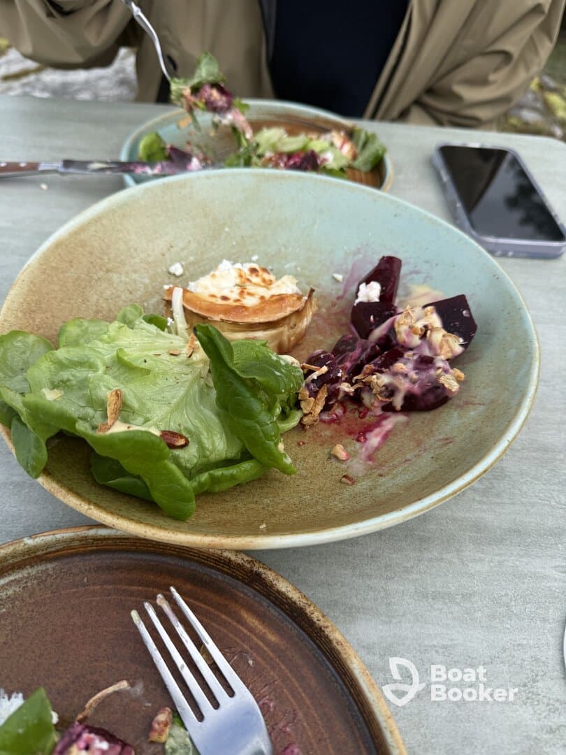 A delicious salad served on a boat, showcasing fresh ingredients and a relaxed dining experience — perfect for enjoying meals on the water.
