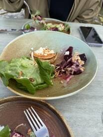 A delicious salad served on a boat, showcasing fresh ingredients and a relaxed dining experience — perfect for enjoying meals on the water.