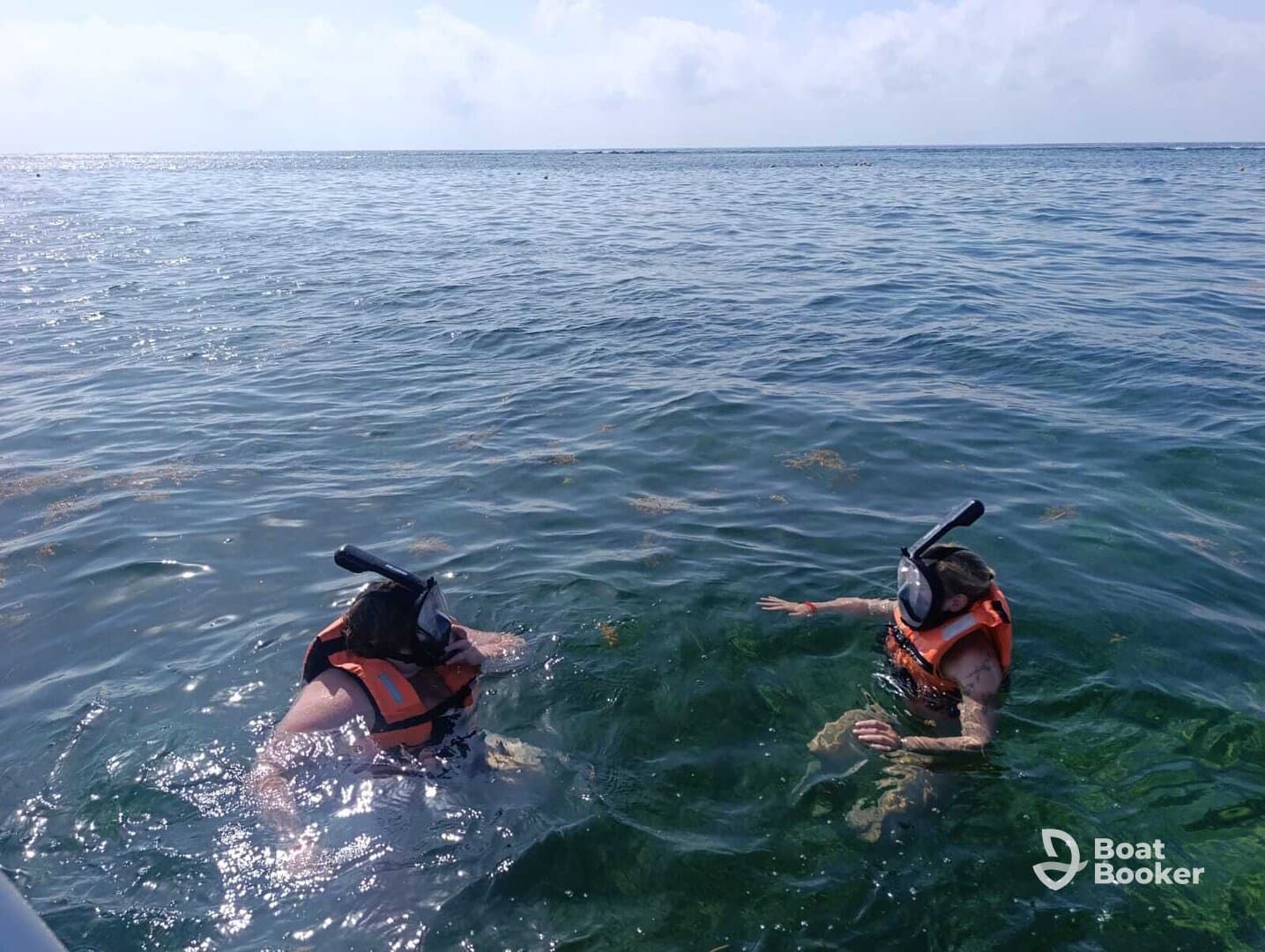 Two snorkelers enjoy the clear waters while exploring marine life, showcasing the excitement of underwater adventures.