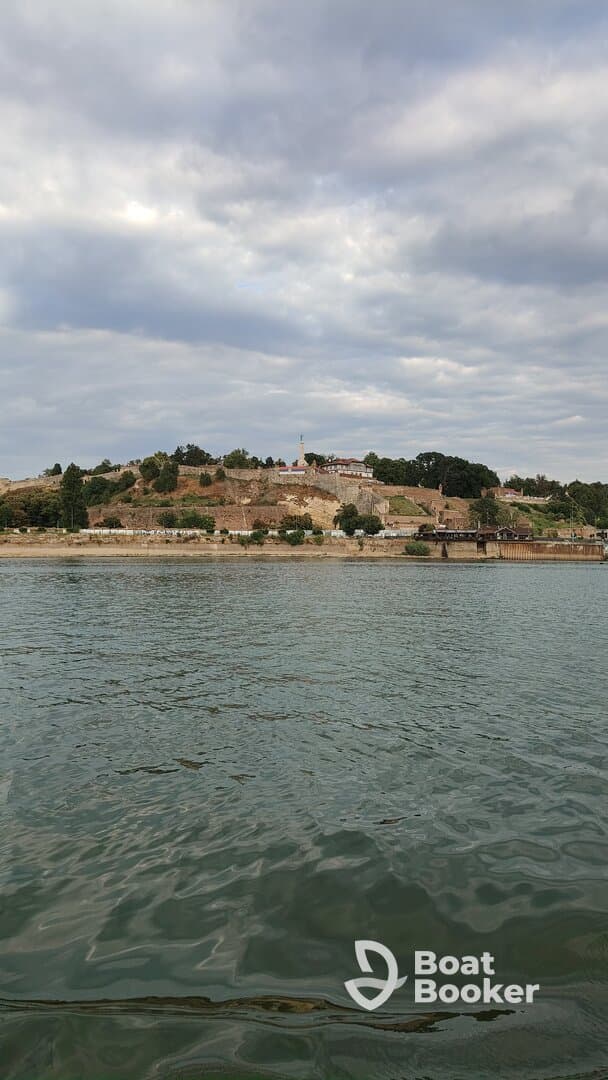 A picturesque view of a historic landmark overlooking the water, showcasing the natural beauty and cultural heritage of the area.