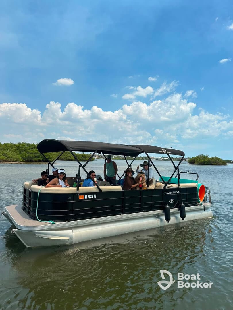 A lively group enjoys a day on a pontoon boat, perfect for socializing and on-water fun in a scenic setting.