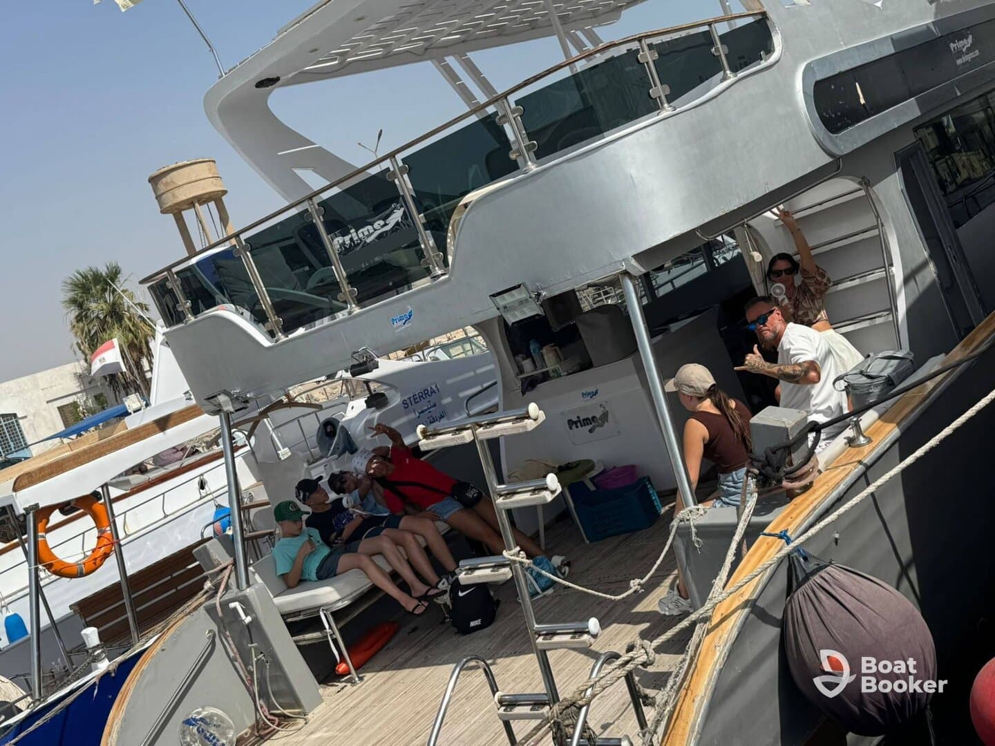 A lively group enjoys their time aboard a boat, capturing moments of fun and celebration in a vibrant atmosphere.