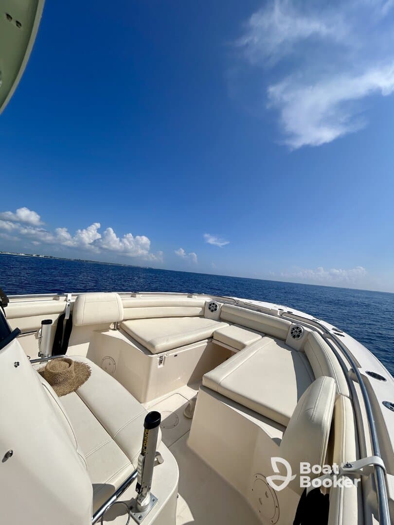 A spacious interior view of a boat's seating area, showcasing comfortable lounge spaces ideal for relaxing on the water.