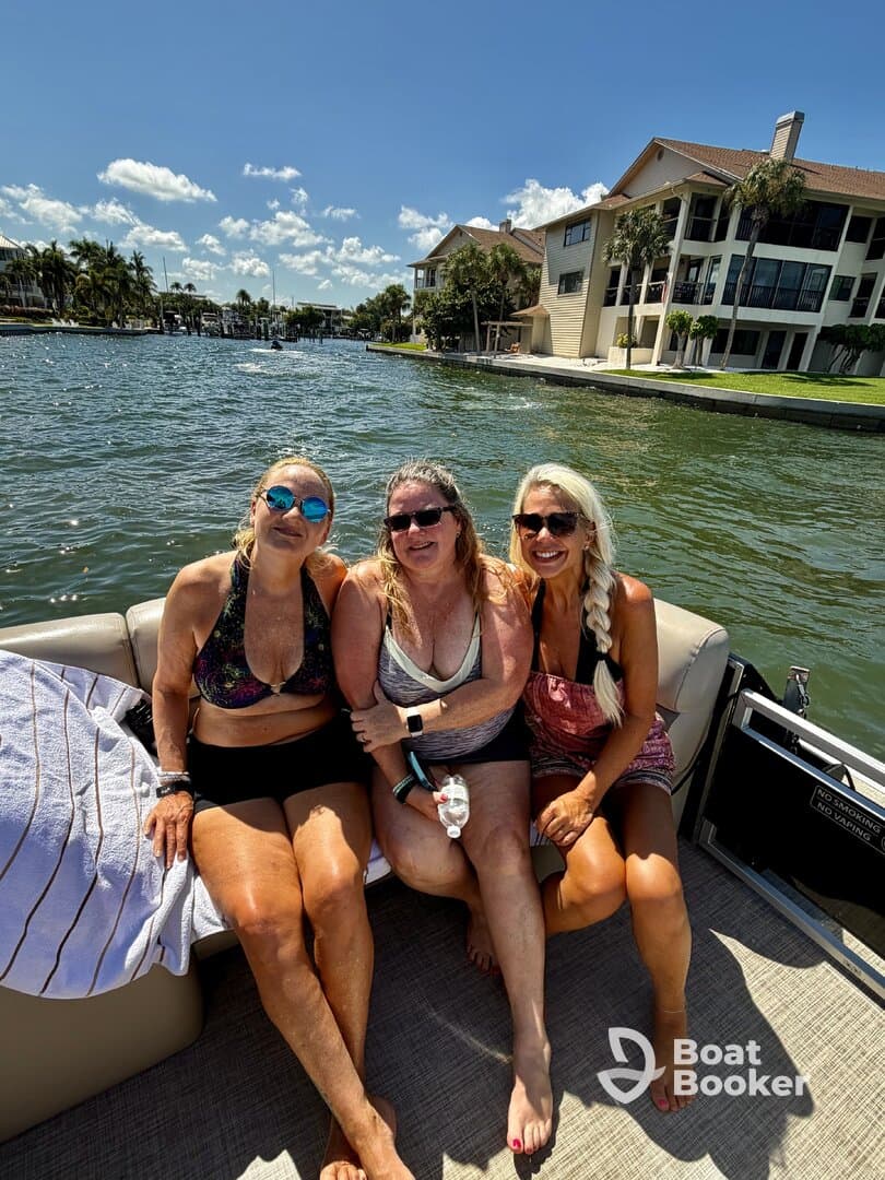 A group of friends enjoys a sunny day on the water, capturing the perfect moment aboard a boat — ideal for fun outings and memorable experiences.