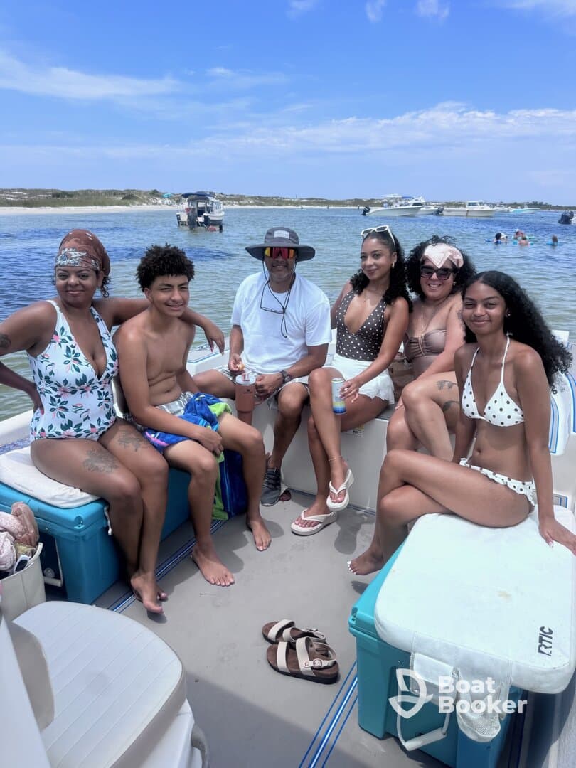 A joyful family enjoys a day on the boat, soaking up the sun and creating lasting memories together in the water.
