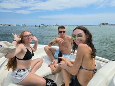 A fun group of friends enjoys a sunny day on the water, capturing the essence of a perfect boating adventure.