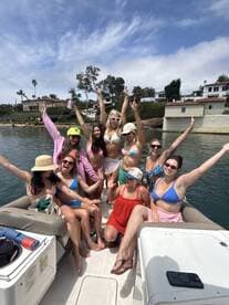 A lively group of friends celebrates on a pontoon boat, showcasing fun and camaraderie under the sun — perfect for summer outings and memorable gatherings.