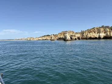 A stunning view of the rugged coastline and cliffs, showcasing the natural beauty of the area — perfect for sightseeing and exploring by boat.