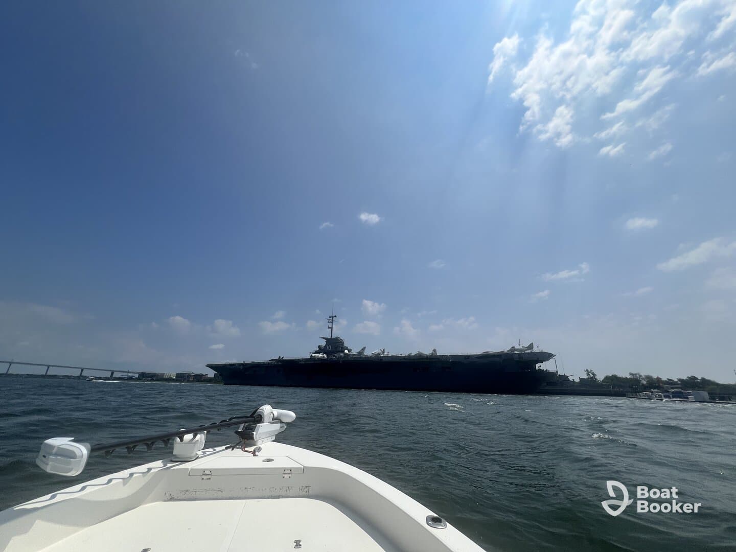 A scenic view of a military ship from a boat, showcasing the beauty of maritime experiences and the thrill of exploring the waters.