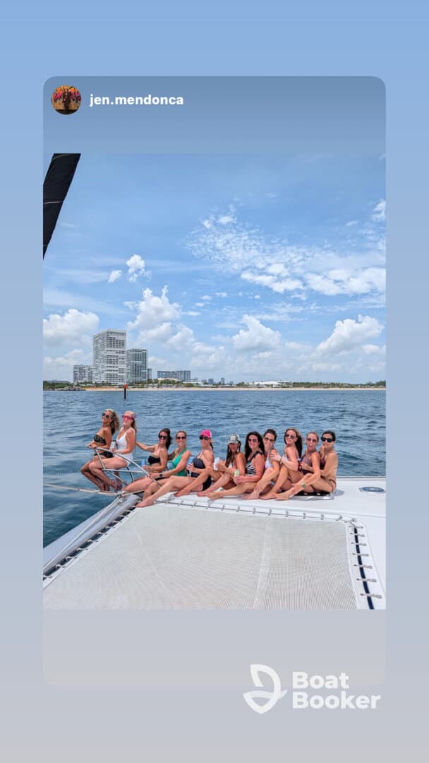 A lively group of friends enjoys a fun day on the water, celebrating together on a boat — perfect for bachelorette parties or summer getaways.