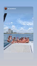 A lively group of friends enjoys a fun day on the water, celebrating together on a boat — perfect for bachelorette parties or summer getaways.