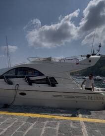 A sleek Rodman yacht docked at the marina, showcasing its elegant design and inviting atmosphere for a perfect day on the water.