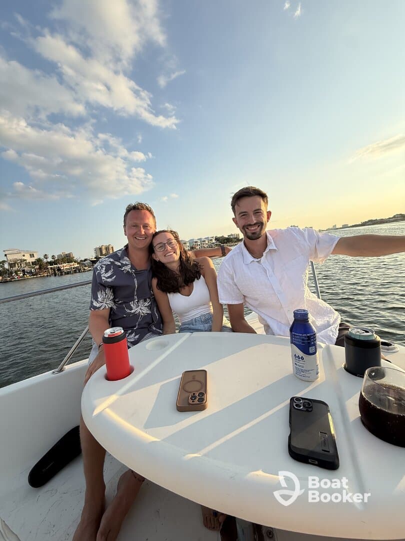 A group of friends enjoys a fun moment on a boat, capturing the essence of a perfect day on the water with laughter and camaraderie.