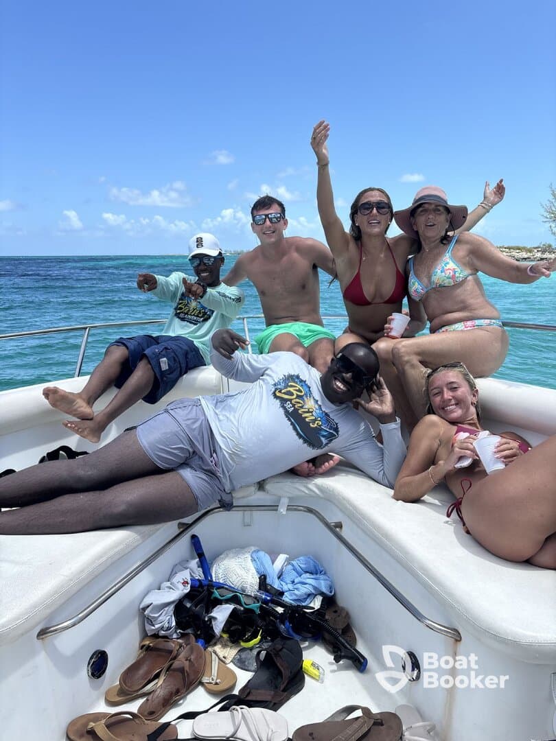 A lively group enjoys a fun day on the boat, celebrating with drinks and laughter under the sun — perfect for unforgettable summer outings.
