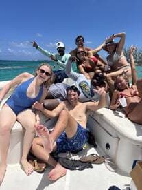A lively group of friends enjoys a fun day on the boat, celebrating under the sun — perfect for summer adventures and unforgettable memories on the water.